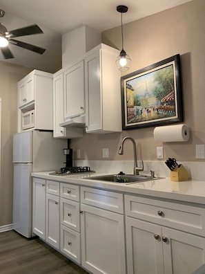 Fridge, microwave, stovetop, coffee/tea maker