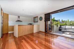 Enjoy meals in the adjacent dining area with a glass door leading to the outdoor patio.