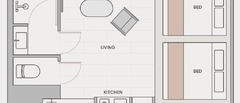 A floor plan of a hotel room with a living area, two bedrooms, a bathroom, and a kitchen.