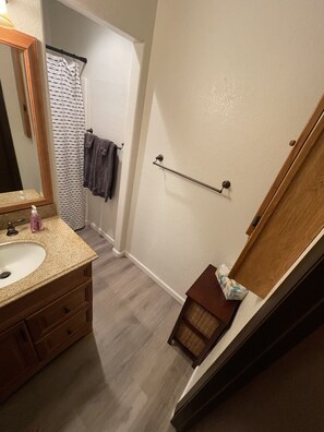 Combined shower/tub, hair dryer, towels, soap