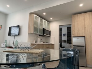 Fridge, microwave, stovetop, coffee/tea maker