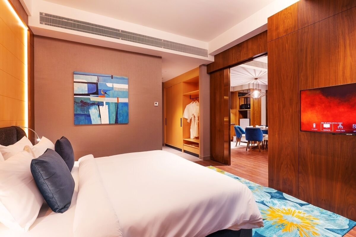 premium suite | in-room safe, desk, laptop workspace, blackout curtains
