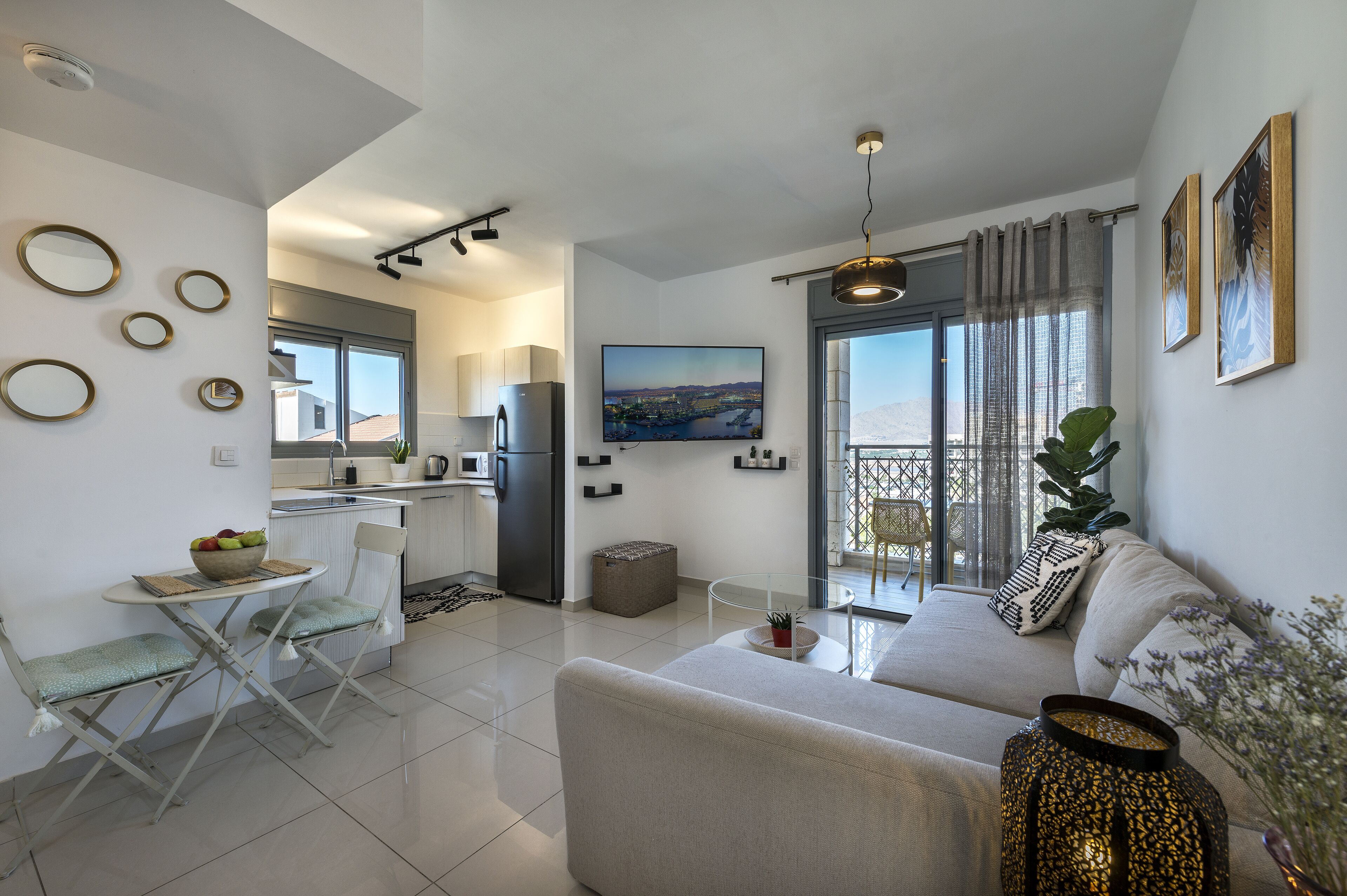 Apartment, 1 Queen Bed with Sofa bed, Balcony, City View | Living area | 55-inch flat-screen TV with cable channels, TV