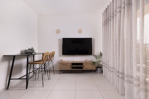 City Apartment, 1 Queen Bed with Sofa bed, Balcony, City View | Living area | 55-inch flat-screen TV with cable channels, TV - Melony Apartment (Eilat)