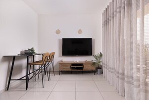 City Apartment, 1 Queen Bed with Sofa bed, Balcony, City View | Living area | 55-inch flat-screen TV with cable channels, TV