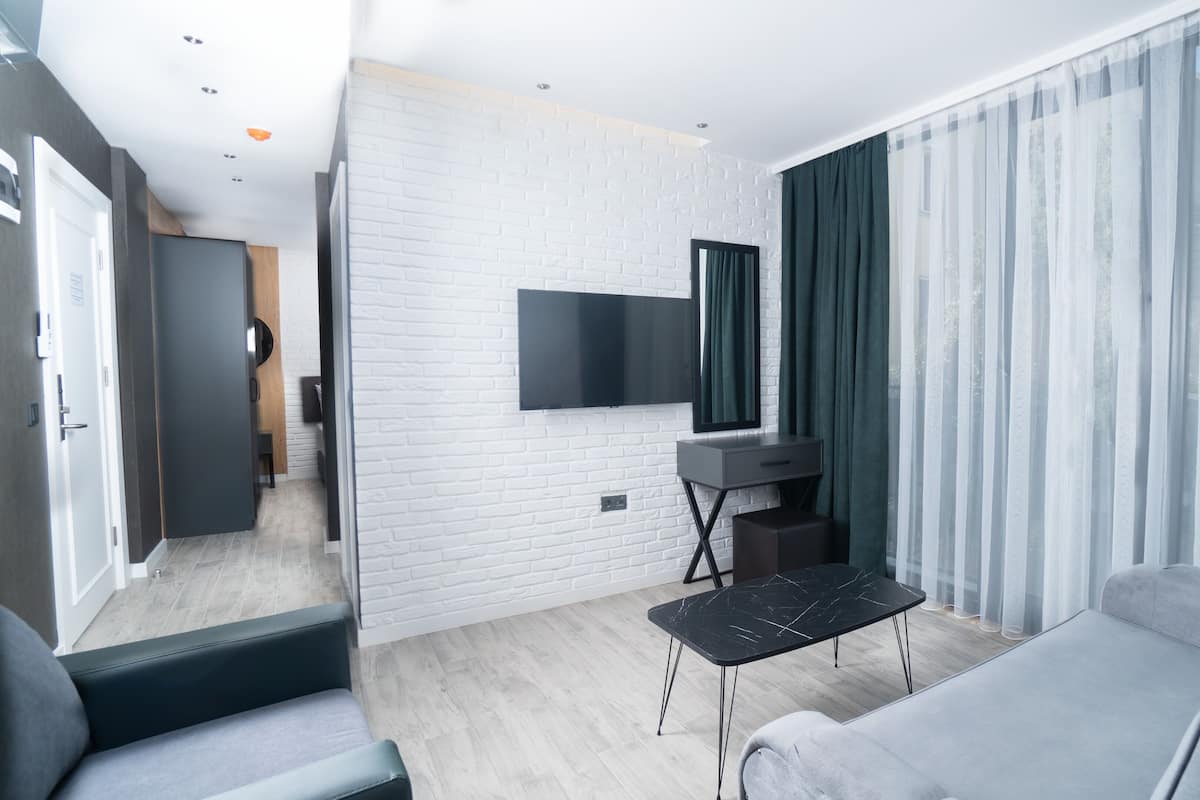 Familie suite | 1 slaapkamer, een minibar, een kluis op de kamer, gratis wifi