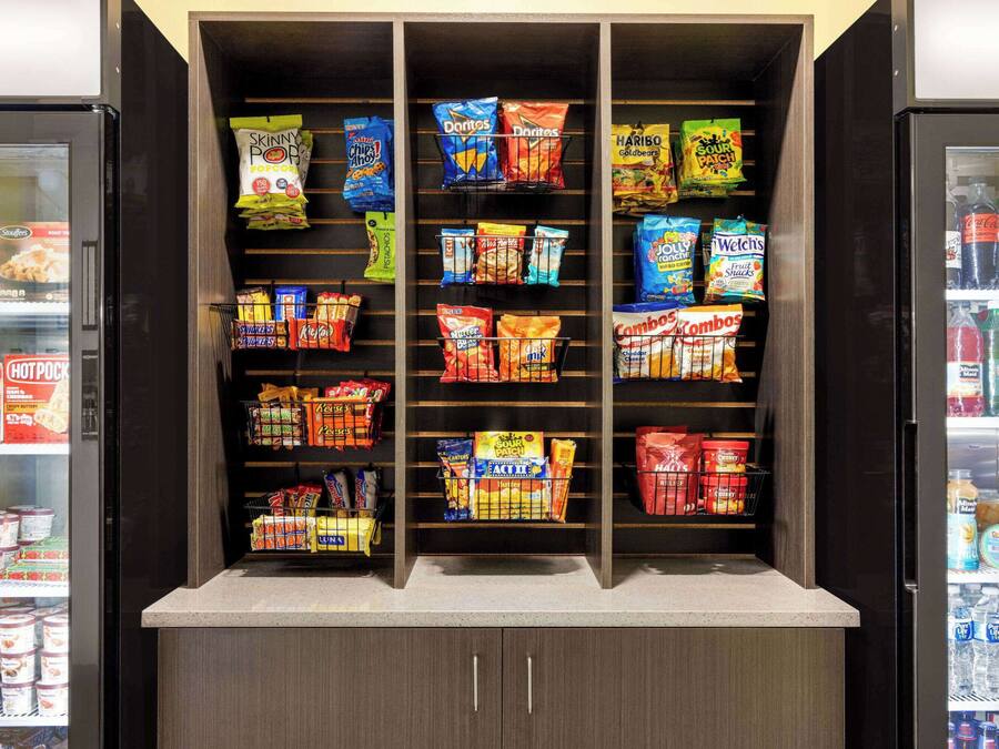 A snack display with various chips and snacks.