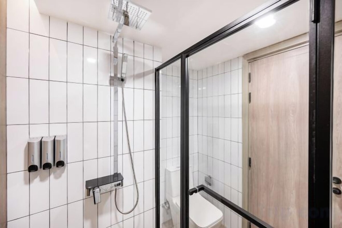 Shower, rainfall showerhead, towels, soap