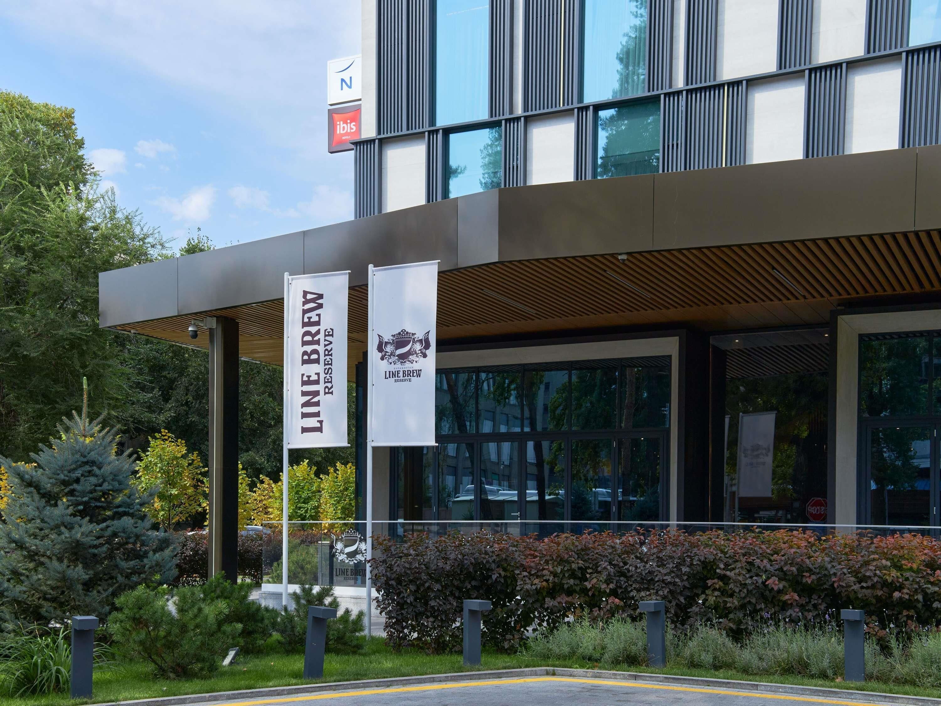 A modern building with two banners for 'Line Brew Reserve' and a 'N' sign above.