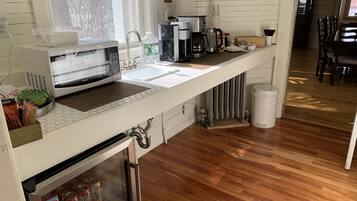 Fridge, microwave, coffee/tea maker, dining tables