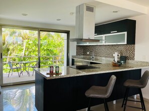 Fridge, microwave, stovetop, coffee/tea maker