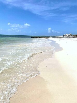 On the beach, sun loungers, beach towels