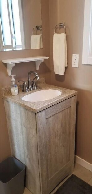 Shower, hair dryer, towels, toilet paper