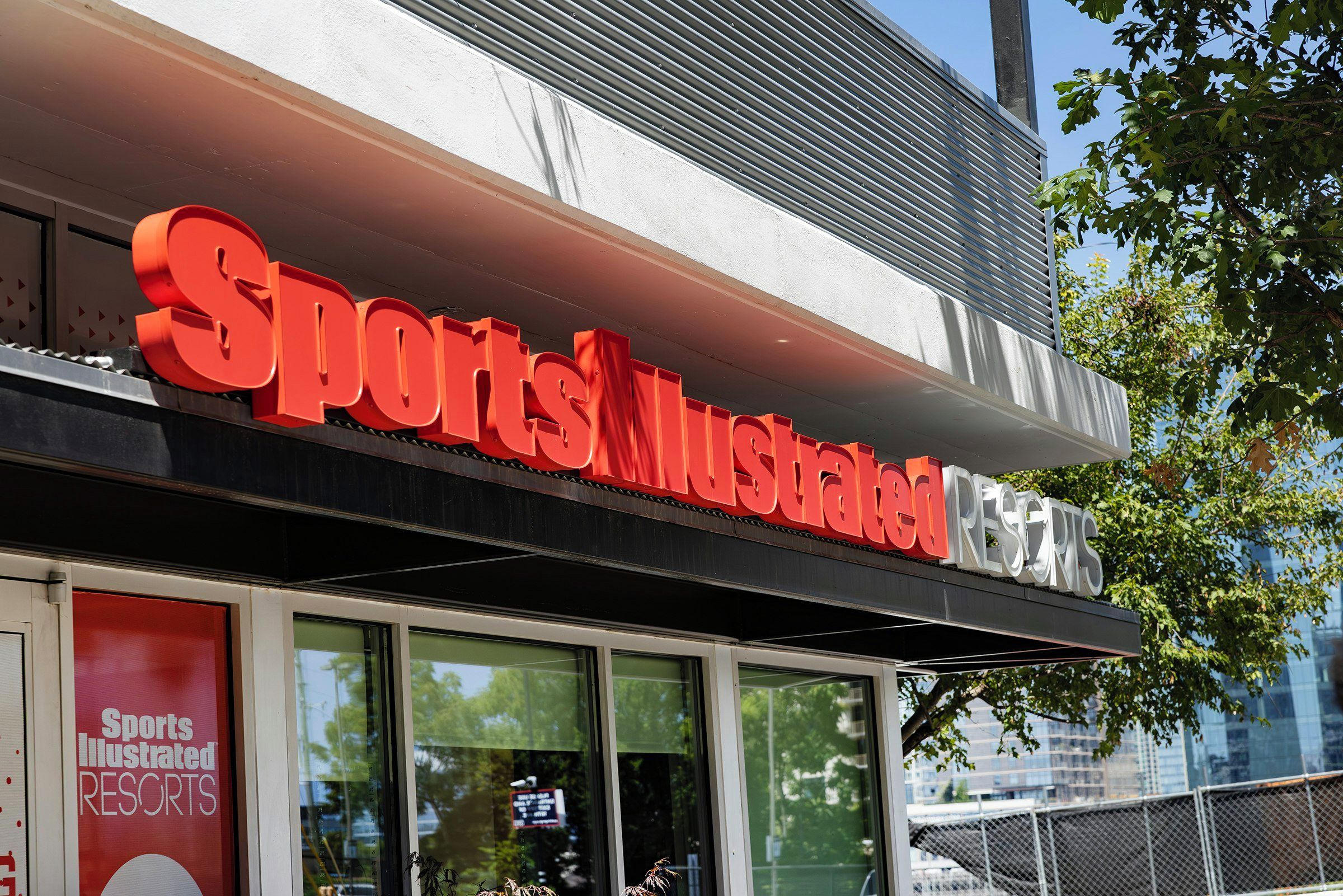 A building with a prominent sign reading 'Sports Illustrated Resorts.'