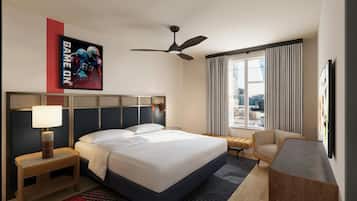 A hotel room with a bed, a desk, a chair, a ceiling fan, and a window with curtains.
