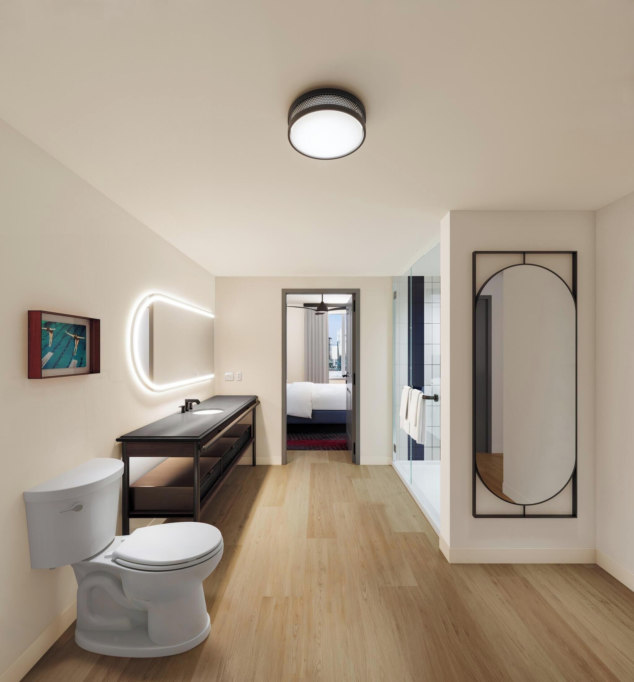 Une salle de bain moderne avec des toilettes, un lavabo et un miroir.
