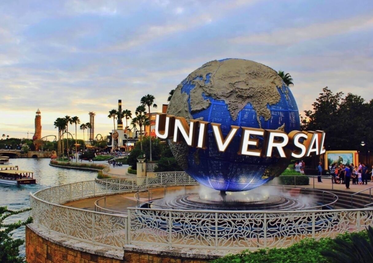 A large globe with 'UNIVERSAL' written on it, surrounded by a decorative railing.