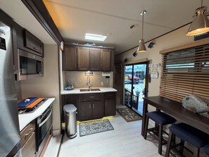 Fridge, microwave, stovetop, coffee/tea maker