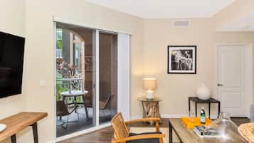 Premium Apartment, 2 Bedrooms, Pool Access | Living area | 50-inch TV with digital channels, streaming services