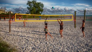 A beach volleyball game with a net and players. - Lake view spacious 2bdr CONDO 7 min by the BEACH (Sarasota)