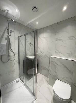 Shower, hair dryer, towels, soap