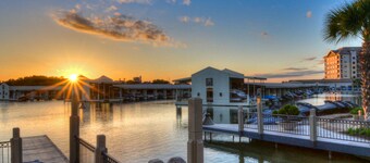 Waterfront condo with furnished balcony, central AC, & washer/dryer