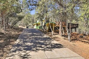 Treehouses blend seamlessly into the surrounding forest, offering a serene retreat amidst nature.