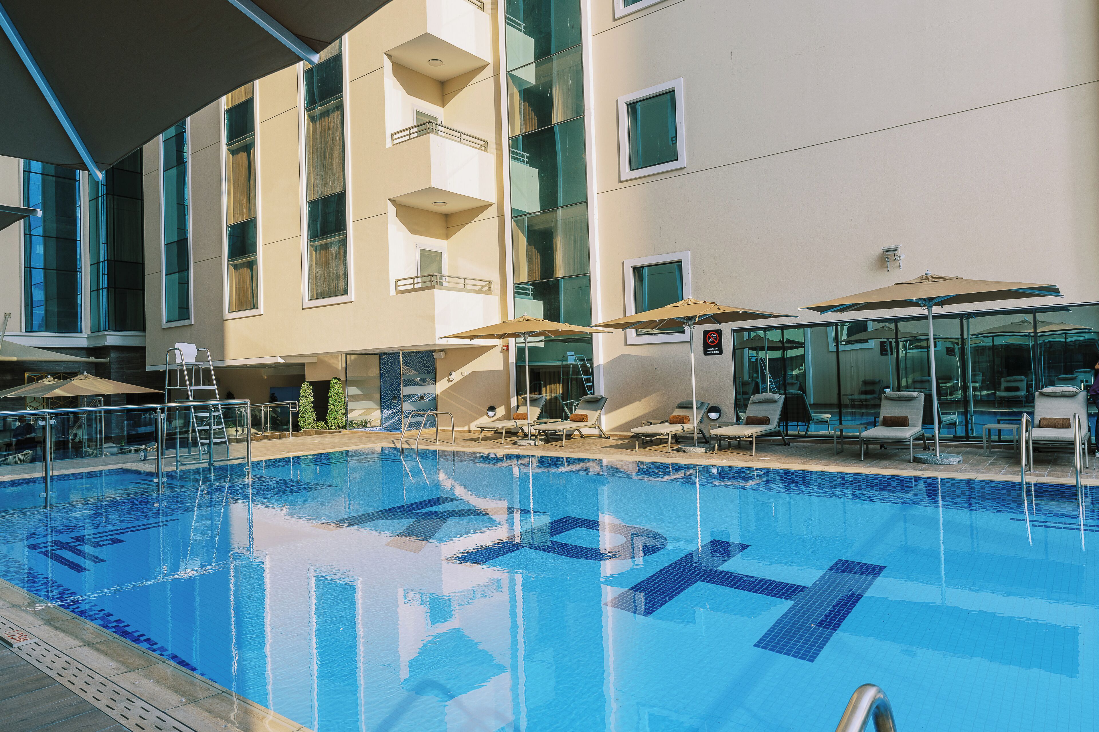 Outdoor pool, pool umbrellas, pool loungers