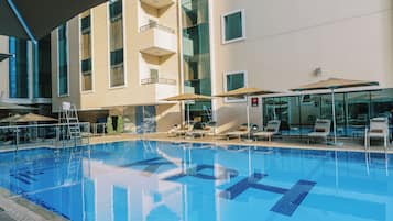 Outdoor pool, pool umbrellas, sun loungers
