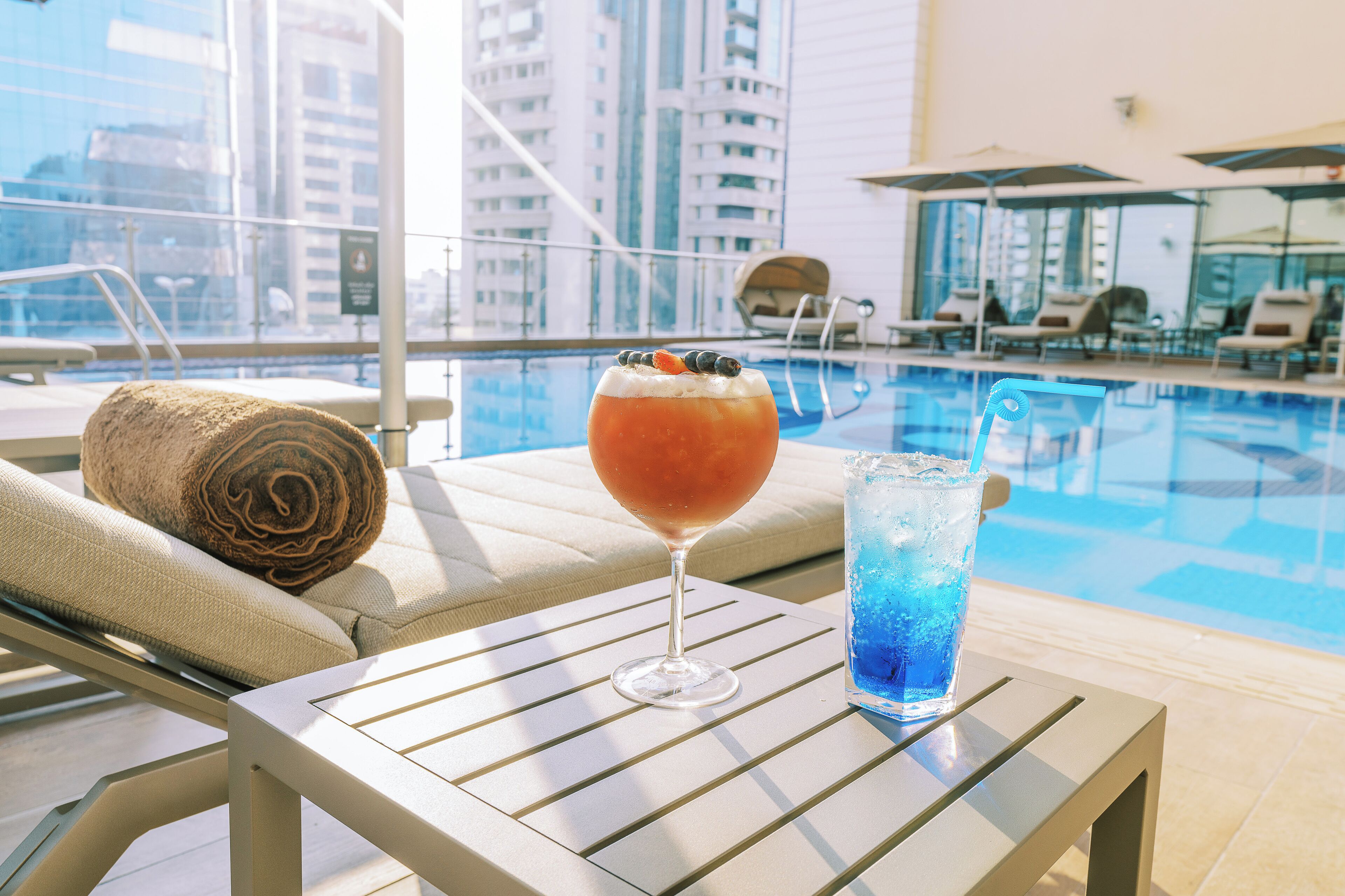 Outdoor pool, pool umbrellas, sun loungers