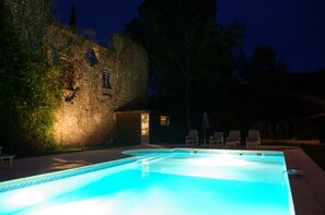 Outdoor pool, a heated pool, pool umbrellas, pool loungers