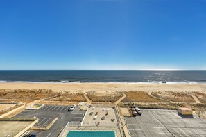 A parking lot with a view of the beach and ocean. - Quay 1008  Direct Ocean Front in/outdoor Pools (Ocean City)