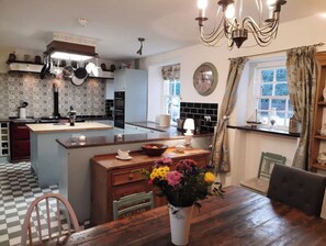 Enjoy a home-cooked meal in this well-appointed kitchen with ample counter space and a dining area for two.