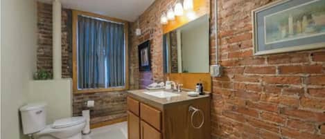 Combined shower/bathtub, hair dryer, towels, soap