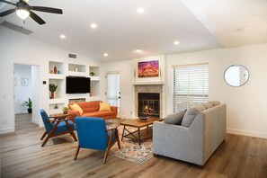 Smart TV, fireplace, books, offices