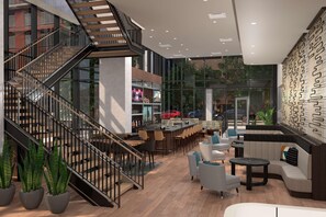 A modern interior with a staircase, seating area, bar, and large windows.