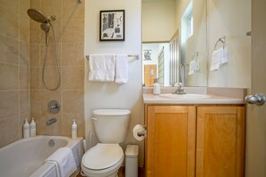 Combined shower/tub, hair dryer, towels, soap