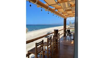 On the beach, sun loungers, beach towels