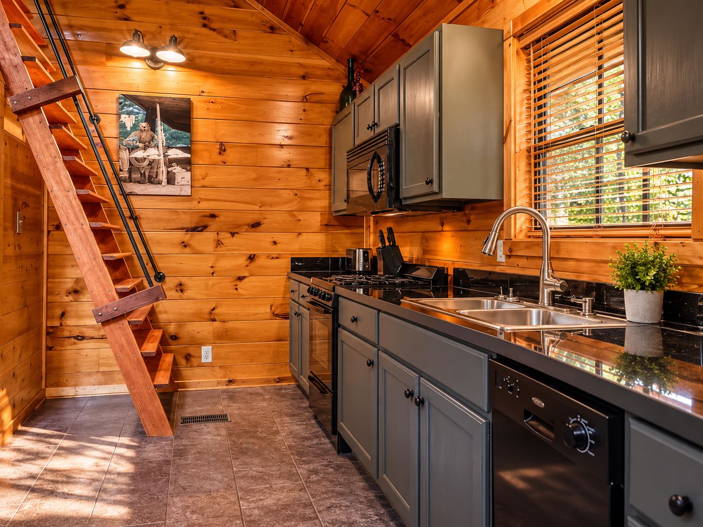 A kitchen with wooden walls, a stainless steel sink, and a dishwasher.
