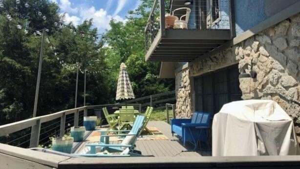 A deck with outdoor furniture, a covered grill, and a stone wall. - Waterfront - Near Ark Encounter (Sparta)