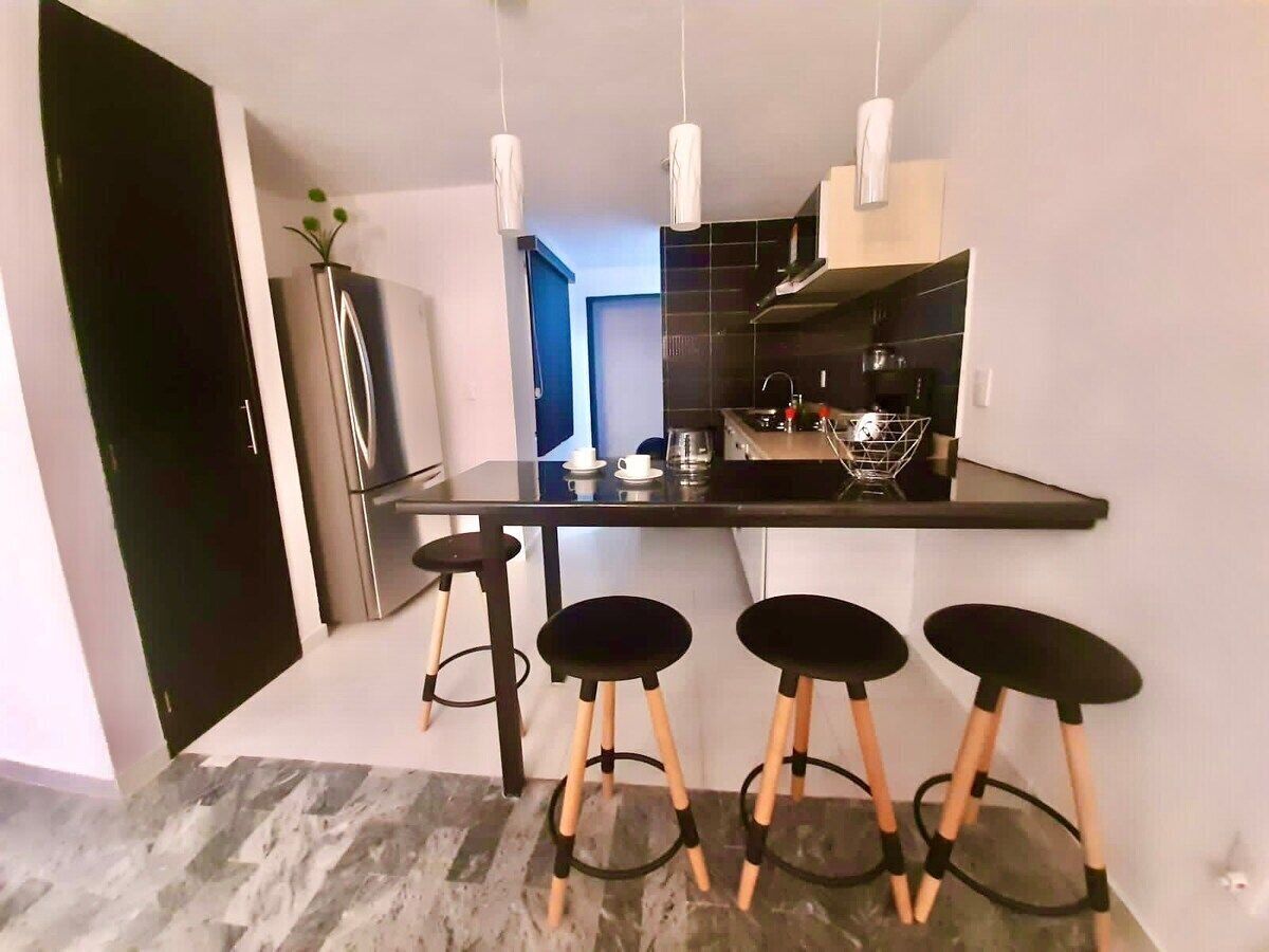 Fridge, microwave, coffee/tea maker, cookware/dishes/utensils