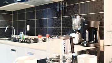 Fridge, microwave, coffee/tea maker, cookware/dishes/utensils