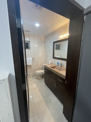 Shower, hair dryer, towels, soap
