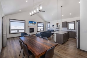 Enjoy a spacious open-plan living area with a dining space, cozy living room, and fully equipped kitchen.