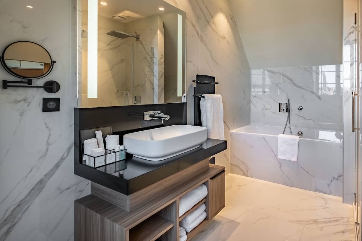 la suite | bathroom | hair dryer, bathrobes, slippers, towels