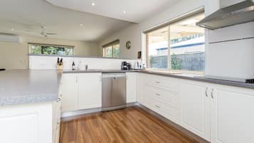 Microwave, dishwasher, dining tables