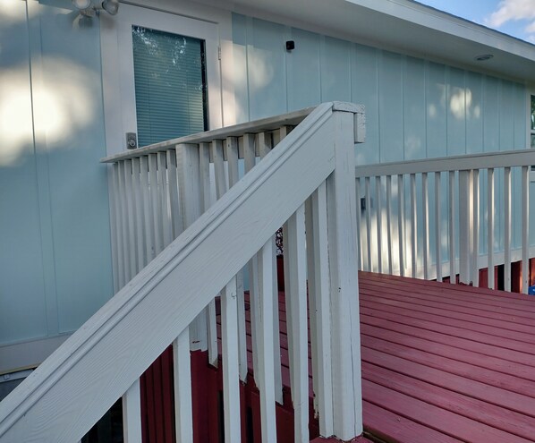 A house with a red deck and white railings. - Cheerful modern, minutes to beach (Nokomis)