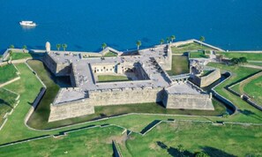 An aerial view of a historic fort with multiple bastions and a moat.
