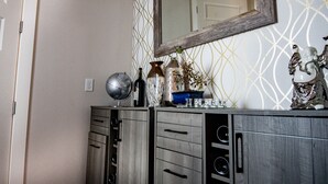 A modern bathroom with a vanity, a mirror, and decorative items. - Mid City Gorgeous Custom 4/3 one block from Street Car (New Orleans)