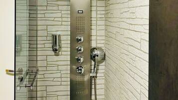 Bathtub, hair dryer, bidet, towels